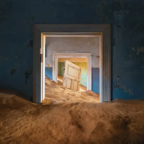 Door and sand in Kolmanskop ghosttown namibia