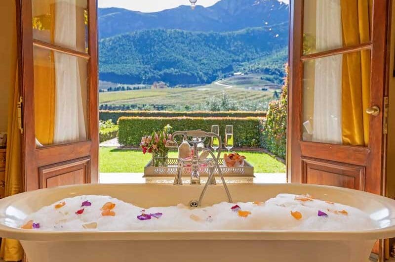 La Residence Luxury Suite bathroom looking out on nature
