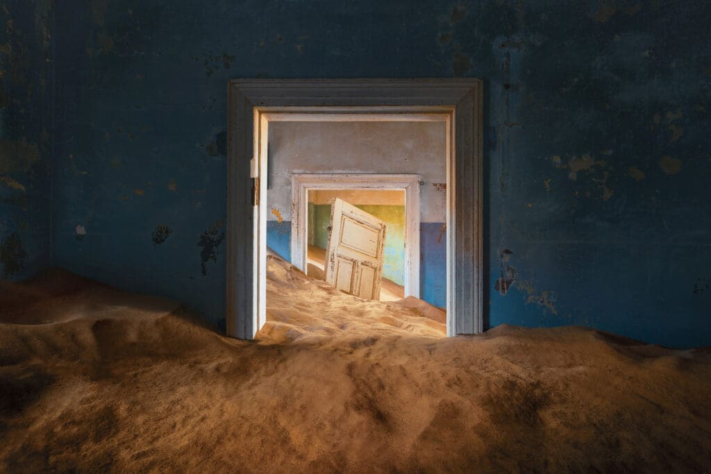 Door and sand in Kolmanskop ghosttown namibia