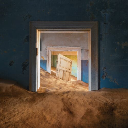 Door and sand in Kolmanskop ghosttown namibia